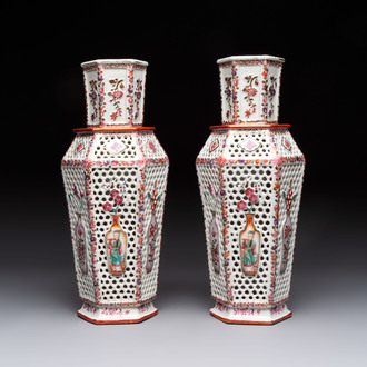 A pair of Chinese famille rose reticulated double-walled 'mandarin subject' vases, Qianlong