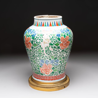 A Chinese wucai 'He He Er Xian' vase on gilt-bronze stand, 19th C.