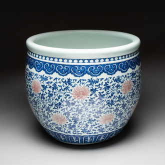 A fine Chinese blue, white and copper-red 'lotus scroll' fish bowl, Qianlong