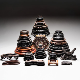 A collection of 37 Chinese wooden stands, 19/20th C.