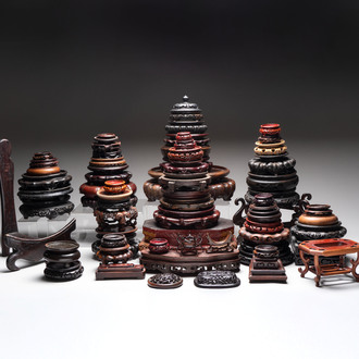A collection of 70 Chinese wooden stands and covers, 19/20th C.