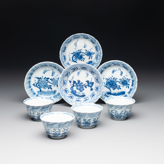 A set of four Chinese blue and white cups and saucers, flower mark, 19th C.