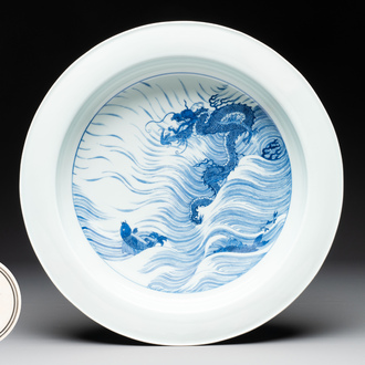 A rare large imperial Chinese blue and white 'dragon and carps' basin, Kangxi mark and of the period