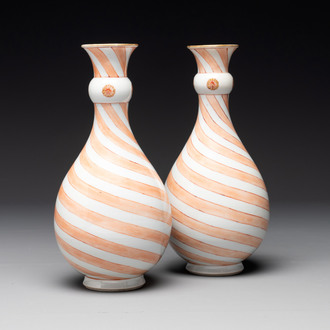 A rare pair of Chinese pear-shaped bottle vases with iron-red swirls, Kangxi