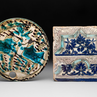 A polychrome Qajar beehive-cover and a tile with floral design, Iran, 18th C.