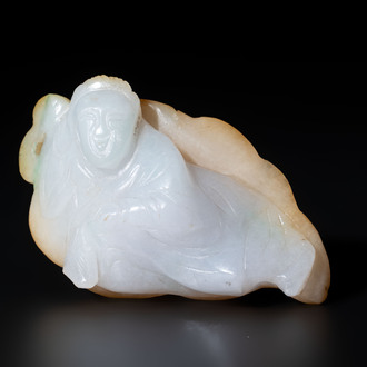 A Chinese white and yellow jade carving of a reclining lady on a leaf, Qing
