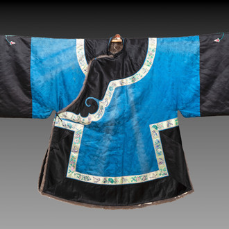 A rare Chinese blue-ground embroidered silk 'butterflies and flowers' robe, lined with fur, 19th C.