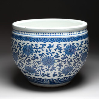 A massive Chinese blue and white 'lotus scroll' fish bowl, Qianlong/Jiaqing