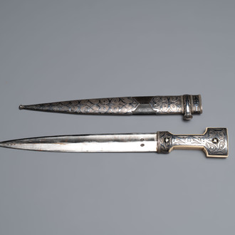 A Caucasian walrus bone-hilted kindjal with niello silver mounts, 19th C.