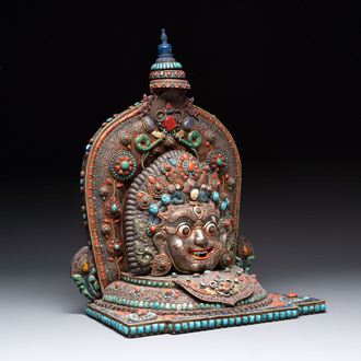 A fine large Nepalese red coral and precious stone-inset brass and silver filigree 'Bhairava' mask, 19th C.