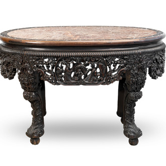 A Chinese finely carved hongmu marble top oval table, Canton, 19th C.