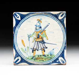A polychrome Dutch Delft maiolica 'soldier' medallion tile, late 16th C.