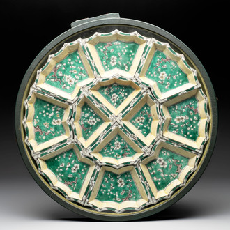 A Chinese verte biscuit 12-piece 'plum blossoms' sweetmeat set in a case, Kangxi