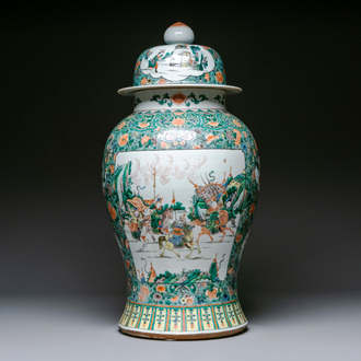 A very large Chinese famille verte 'warriors on horseback' vase and cover, 19th C.