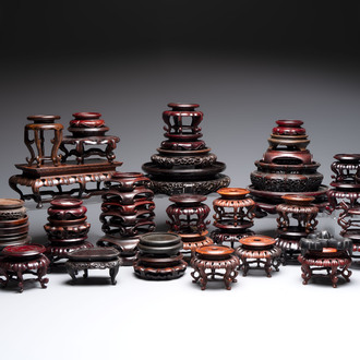 A collection of 45 Chinese wooden stands, 19/20th