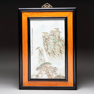 A Chinese famille rose ‘mountainous landscape’ plaque in wooden frame, signed Wang Xiliang 王锡良, dated 1931