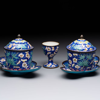 A pair of Chinese blue-ground Canton enamel covered bowls on stands and an egg cup, Qianlong/Jiaqing