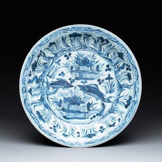 A rare Chinese blue and white 'fish swimming in a lotus pond' dish, Hongzhi/Zhengde