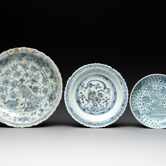 A Chinese blue and white 'phoenix' dish and two 'Buddhist lion' and 'peony' plates, Hongzhi/Zhengde