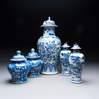 Two pairs of Chinese blue and white covered vases and a large covered vase, 19th C.