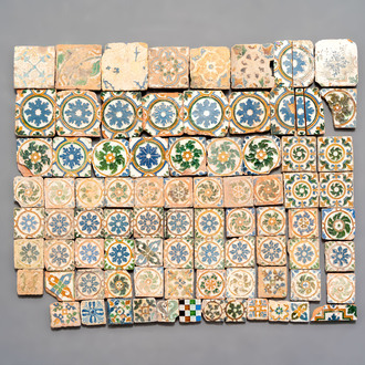 A varied collection of 84 polychrome Spanish tiles with floral design, 15/17th C.