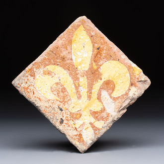 A medieval slip-decorated ‘Fleur-de-Lys’ tile, probably France or Flanders, 14th C.