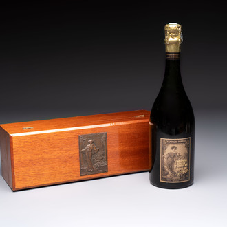 A bottle of Cuvée Spéciale Louise Pommery Vintage 1980 Champagne, presented in a commemorative box fitted with a bronze plaque