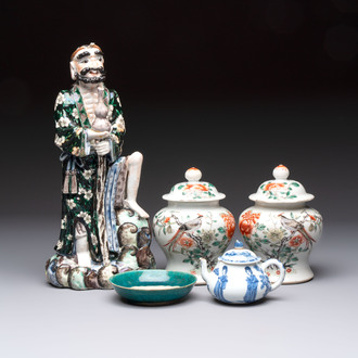 A pair of Chinese famille verte covered jars, a Tieguai Li figure, a blue and white teapot and a biscuit saucer, Kangxi and Qing Yu Tang mark, 19th C.
