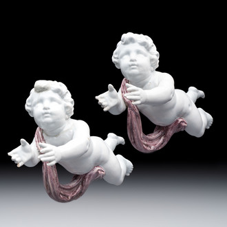 A pair of manganese and white Delftware putti, France or Germany, 19th C.