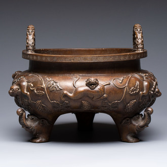 A rare Chinese bronze tripod censer with relief mythical animal and grape design, Xuande mark, 19th C.