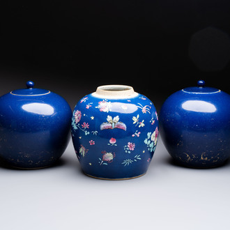 A pair of Chinese gilt-decorated powder-blue-ground covered jars and a famille rose powder-blue-ground jar, 18/19th C.