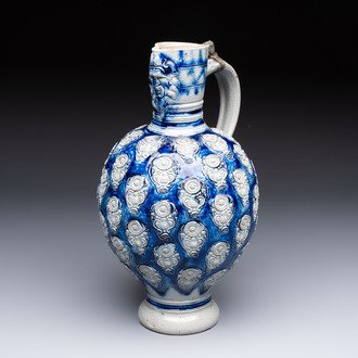 A Westerwald stoneware jug with a lion's head and moulded floral design, Germany, 17th C.