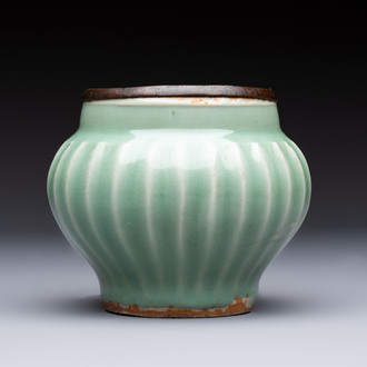 A Chinese Longquan celadon 'Lotus' jar with bronze mount, Song