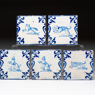 Five blue and white Dutch Delft 'Candelabra' tiles with dogs and a fox, 17th C.
