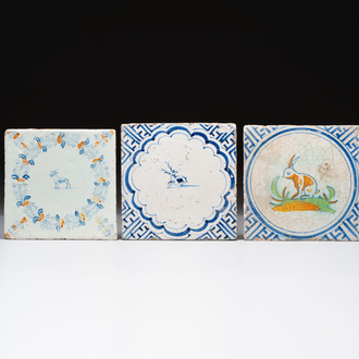 A blue and white Dutch Delft 'Stag' tile and two polychrome 'Goat' and 'Rabbit' tiles, 17th C.