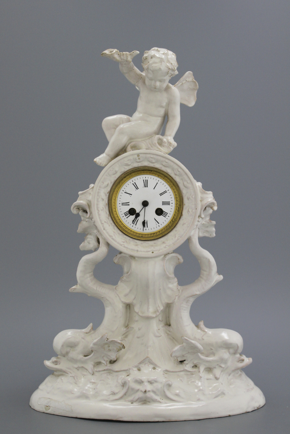 A large monochrome white, probably Brussels faienc clock, late 18th/early 19th C.