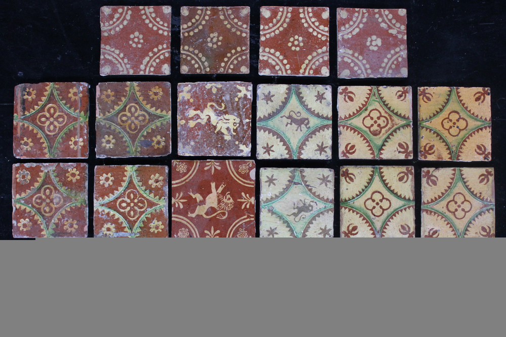 A lot of 20 various slipware decorated post-medieval tiles, 17/18th C., Franco-Flemish