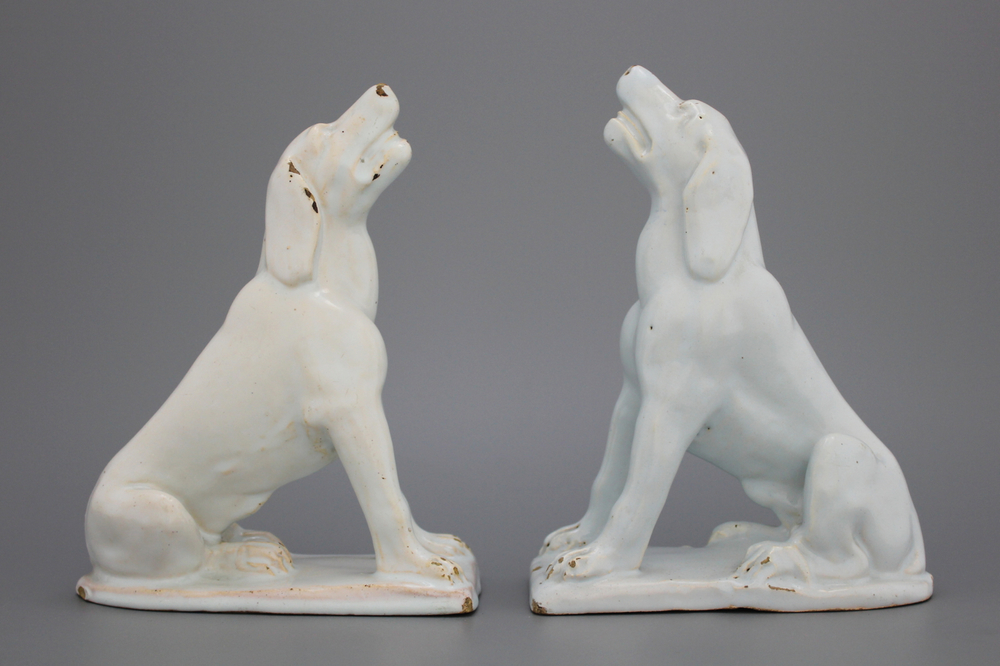 A pair of Brussels faience white figures of dogs, 18th C.