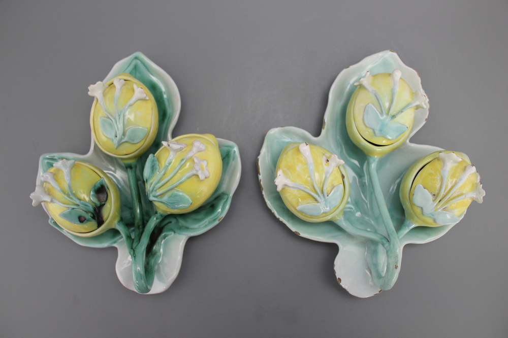 A pair of German faience tri-lobed spice boxes modelled as water lilies, 18th C.