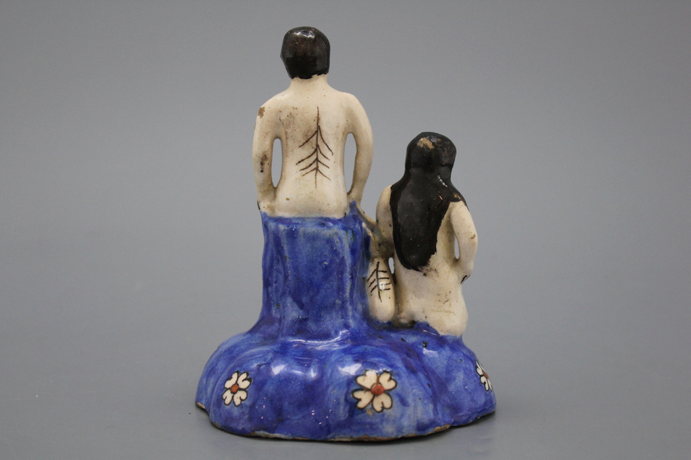 A Qadjar figural group with a nude man and woman with a dog, 19th C.