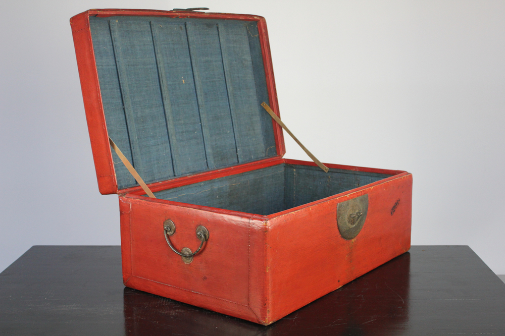 A Chinese red leather trunk, early 20th C.