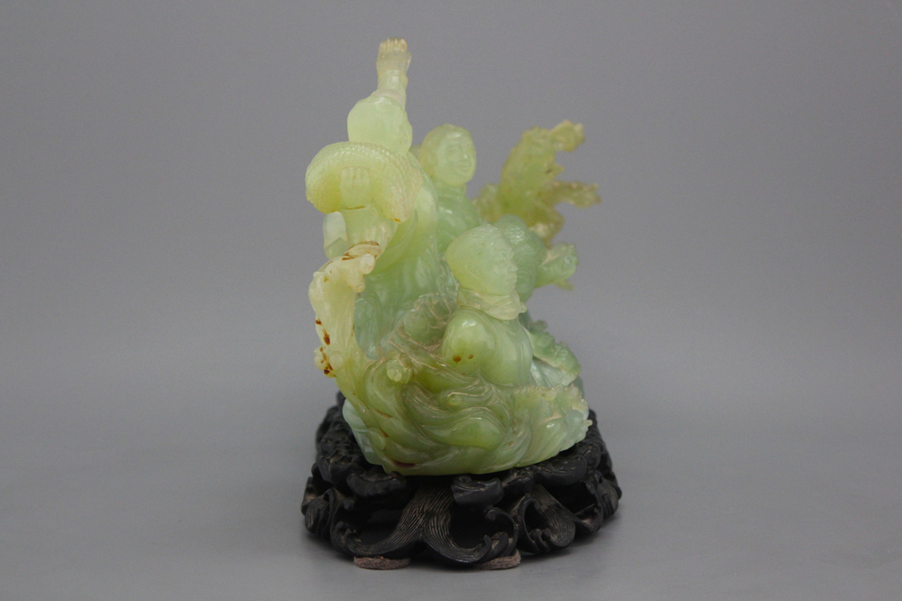 A Chinese carved jadeite group, Cultural Revolution, 20th C.