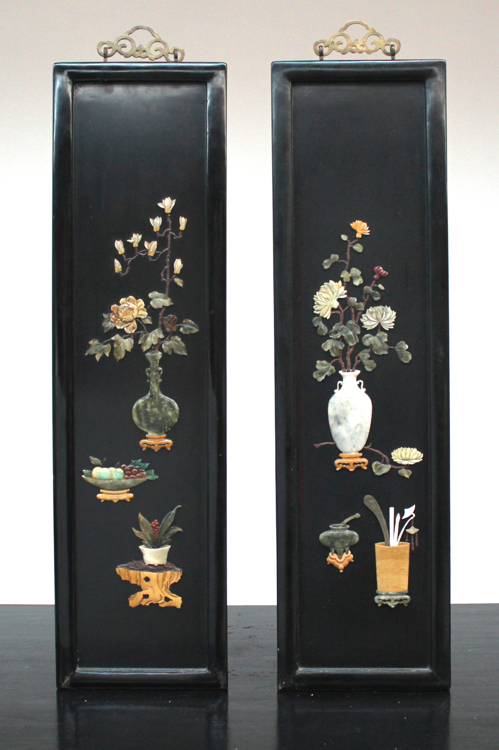 A pair of Chinese lacquer and semi-precious stones panels, early 20th C.