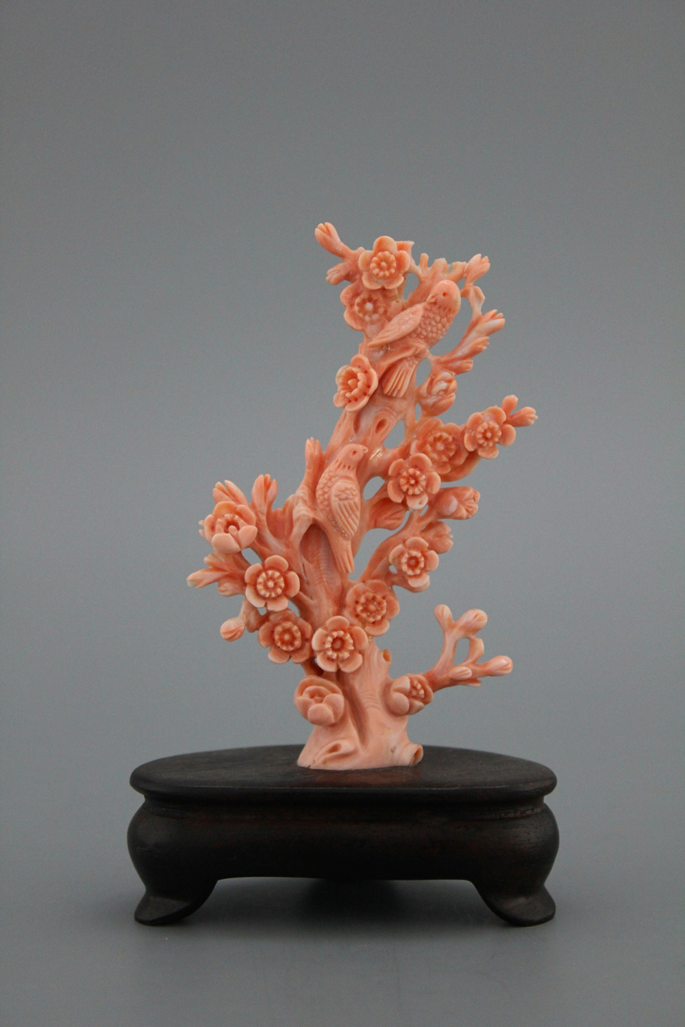 A carved Chinese red coral sculpture of birds and flowers, 19/20th C.