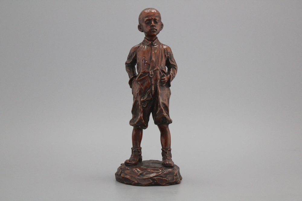 A brass figure of a boy, early 20th C.