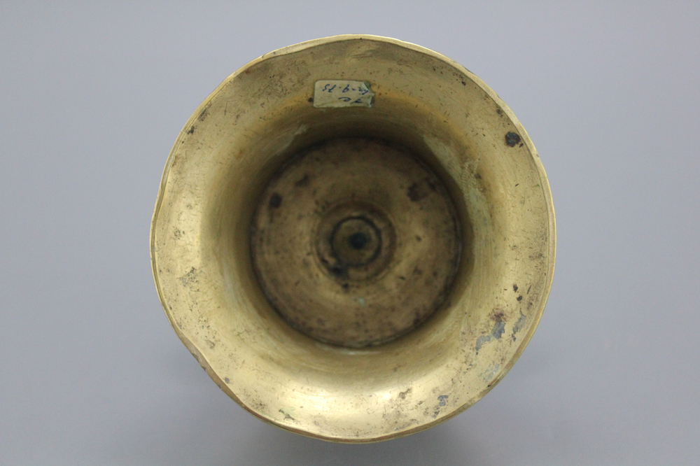A Flemish brass capstan candlestick, 16th C.