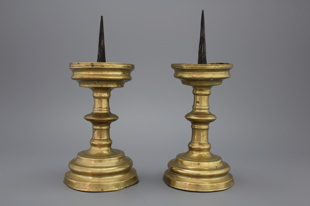 A pair of brass pricket candlesticks, 16th C.