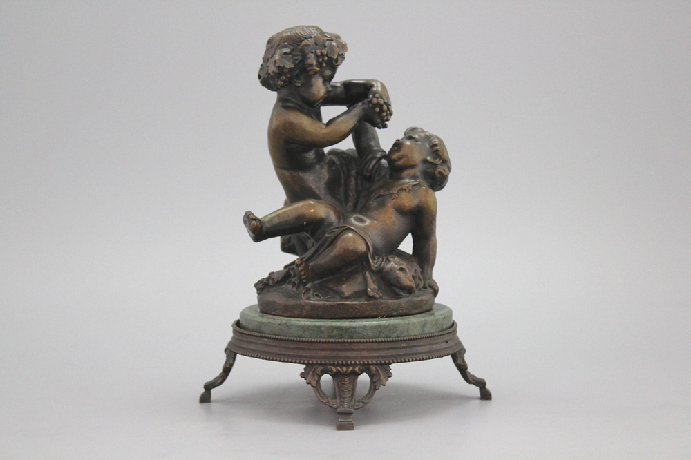 A bronze group depicting the young Bacchus , signed Clodion, 19th C.