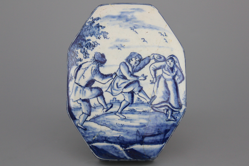 A Dutch Delft brush back with a dancing scene, 18th C.
