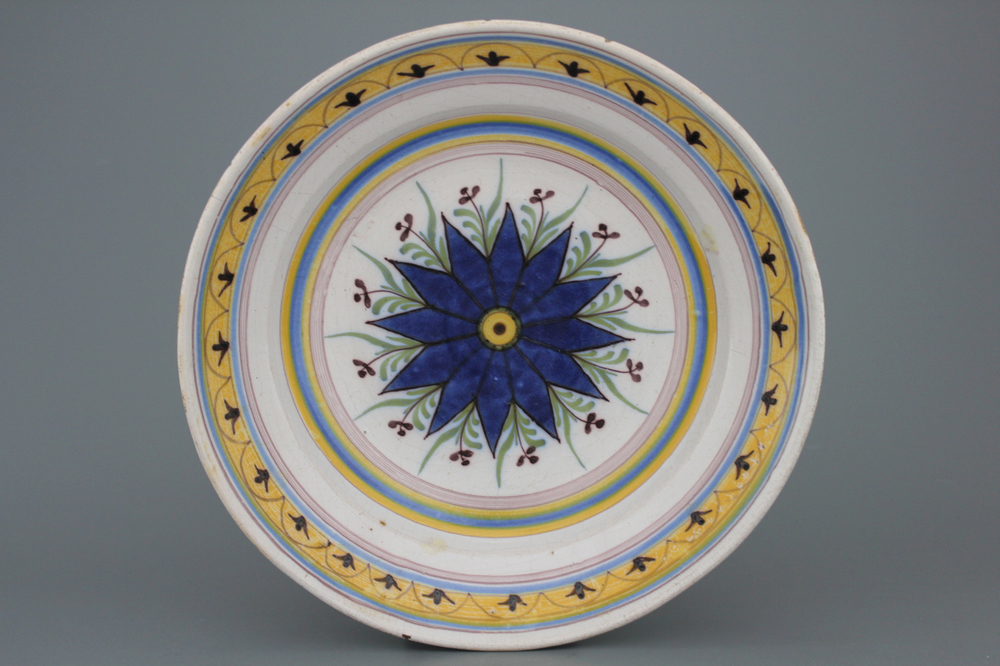 A fine Brussels faience dish with a central star, late 18th C.